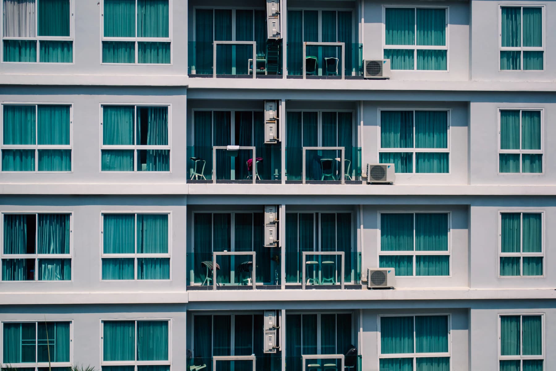 A residential facade with repeating balconies.